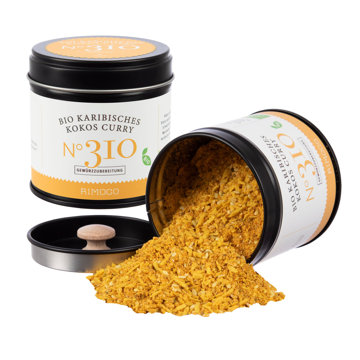 Eine offene Dosis Bio Curry Gewürz-Set N°1 mit gelbem, gemahlenem Gewürz, das herausrieselt.