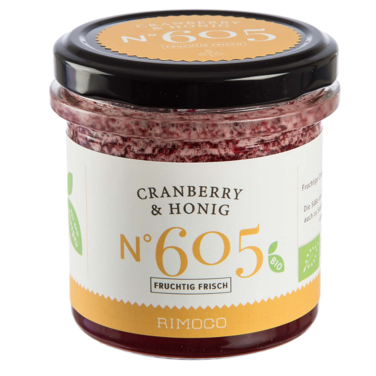 Cranberry & Honig Aufstrich im Glas mit schwarzem Deckel und gelbem Etikett.