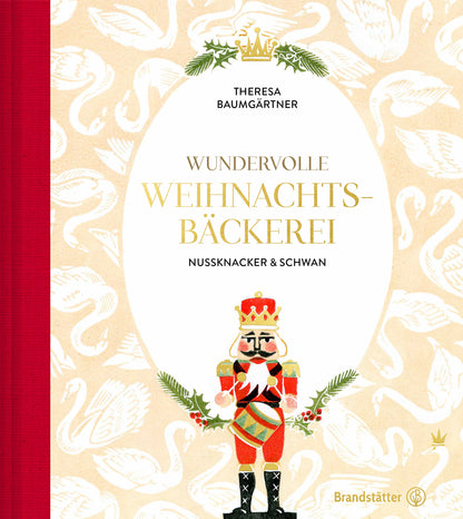 Buchcover mit Nussknacker, Schwan und dem deutschen Titel Geschenkset Wundervolle Weihnachtsbäckerei.