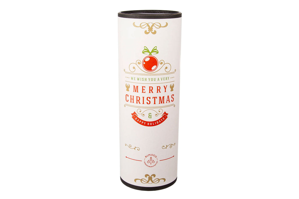 Zylindrische Geschenkbox mit der Aufschrift „Merry Christmas“ und weihnachtlichen Motiven auf weißem Hintergrund.