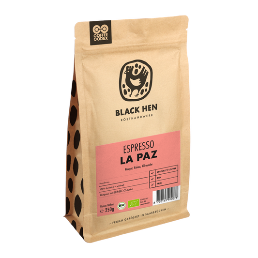 Bio Espresso LA PAZ Kaffee in brauner Tüte mit pinkem Etikett und schwarzem Huhn-Logo auf der Vorderseite.