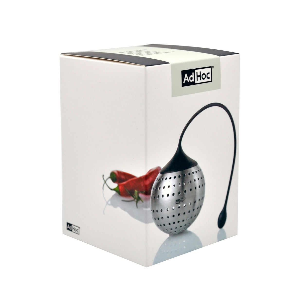 Spice Bomb Gewürzfilter von Adhoc mit Verpackung und roten Chilischoten auf weißem Hintergrund.