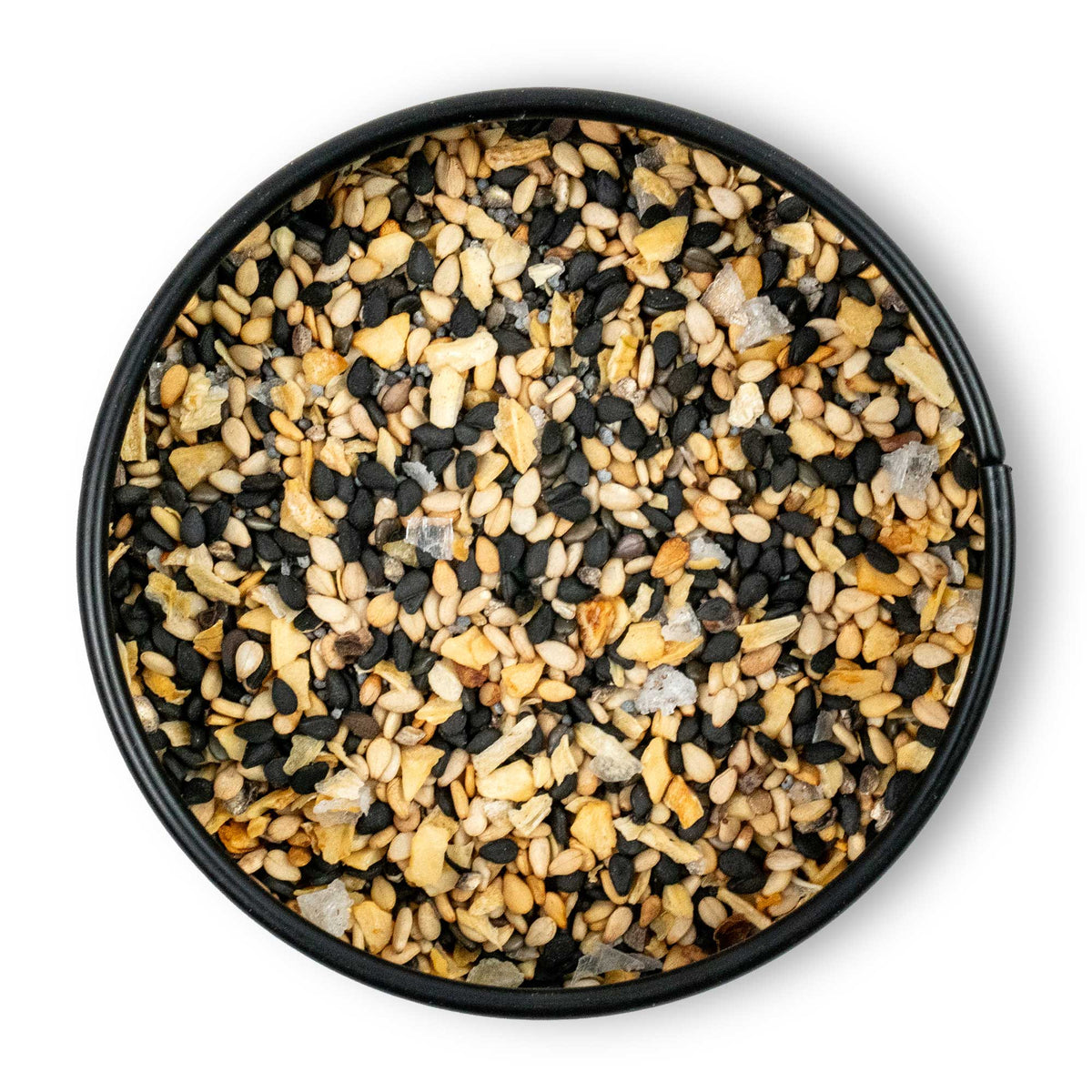 Runde Schale mit grobem Annes Bagel Spice: Sesam, Mohn, getrockneter Knoblauch und Salz von oben.