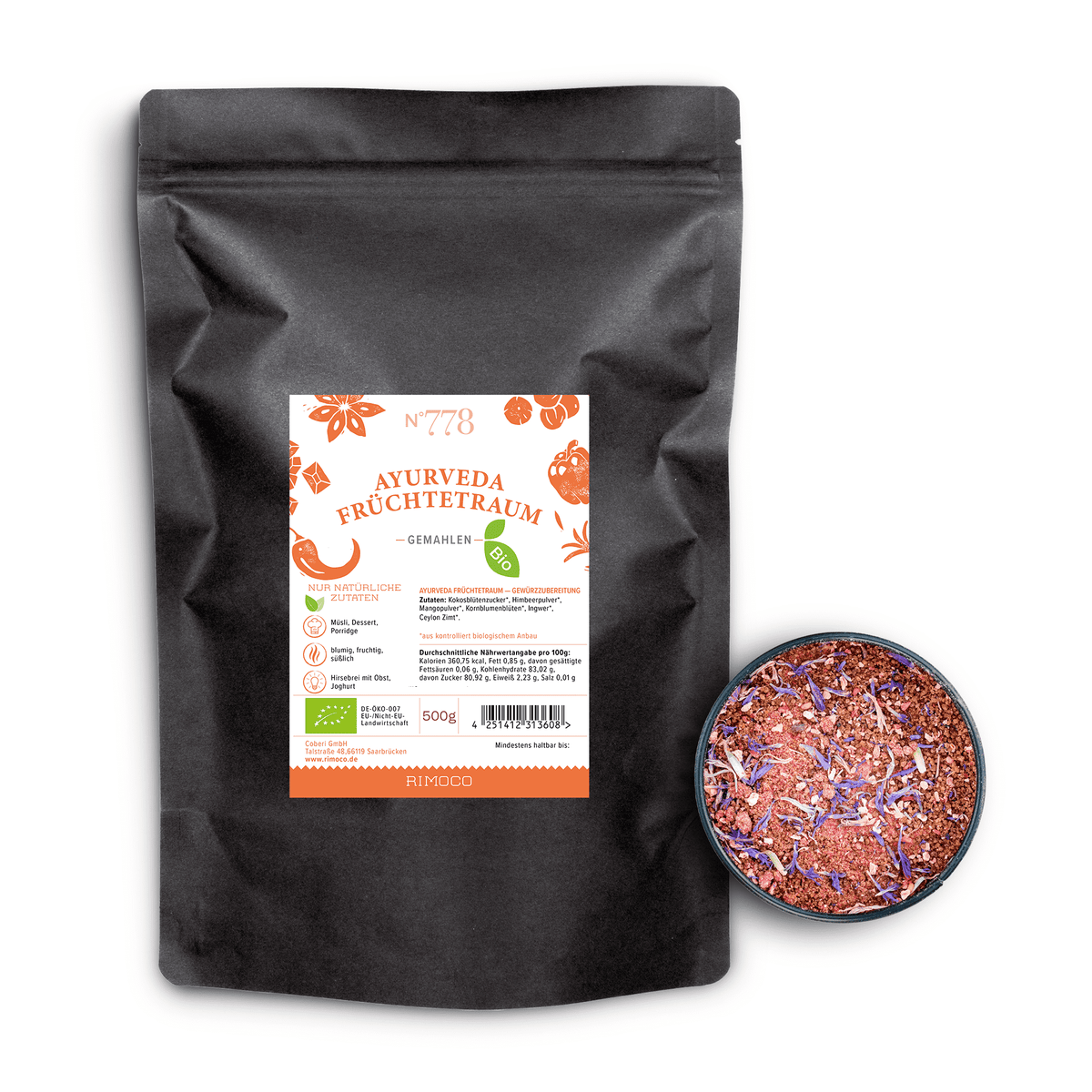 Bio Ayurveda Früchtetraum Kräutertee in schwarzem Beutel neben einer Schale mit losem Teeblatt-Mix.