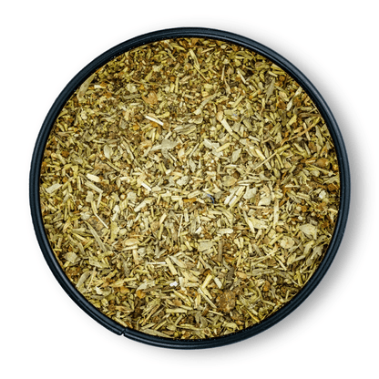 Bio Ayurveda Mediterran Dose rund, von oben gesehen, daneben getrocknete Kräuter.