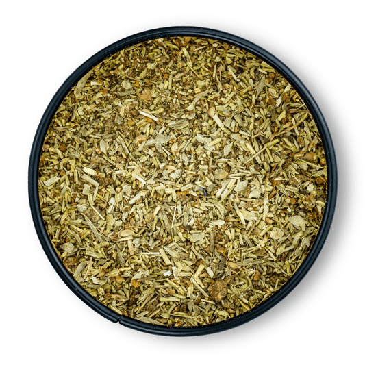 Bio Ayurveda Mediterran Dose rund, von oben gesehen, daneben getrocknete Kräuter.
