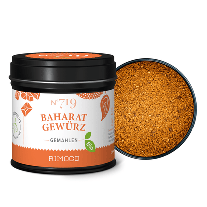 Bio Baharat Gewürz Dose mit orangem Pulver; Deckel liegt daneben.