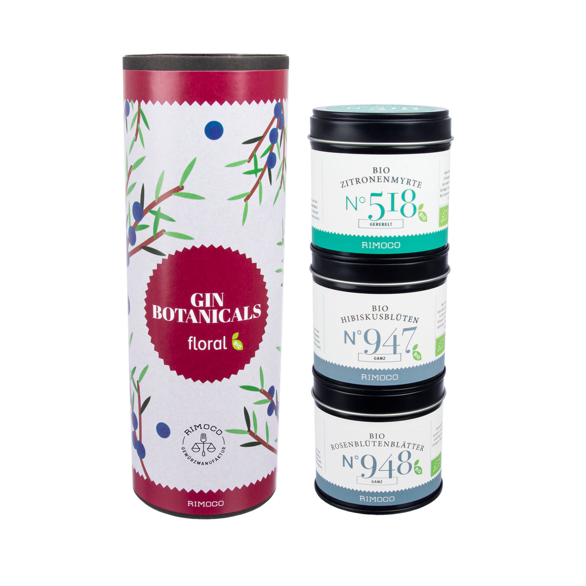 Drei gestapelte Dosen Bio-Tee 518, 947 und 948 in einer floralen Bio Gin Botanicals-Röhre.