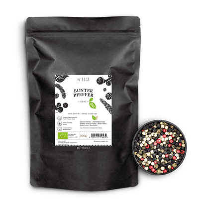 Bio Bunter Pfeffer schwarze Tüte neben Schale mit ganzen bunten und weißen Pfefferkörnern.