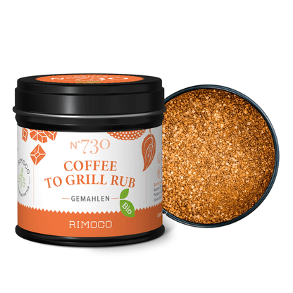 Offenes Glas Bio Coffee To Grill Rub mit grober, röstaromenreicher Gewürzmischung sichtbar im Inneren.
