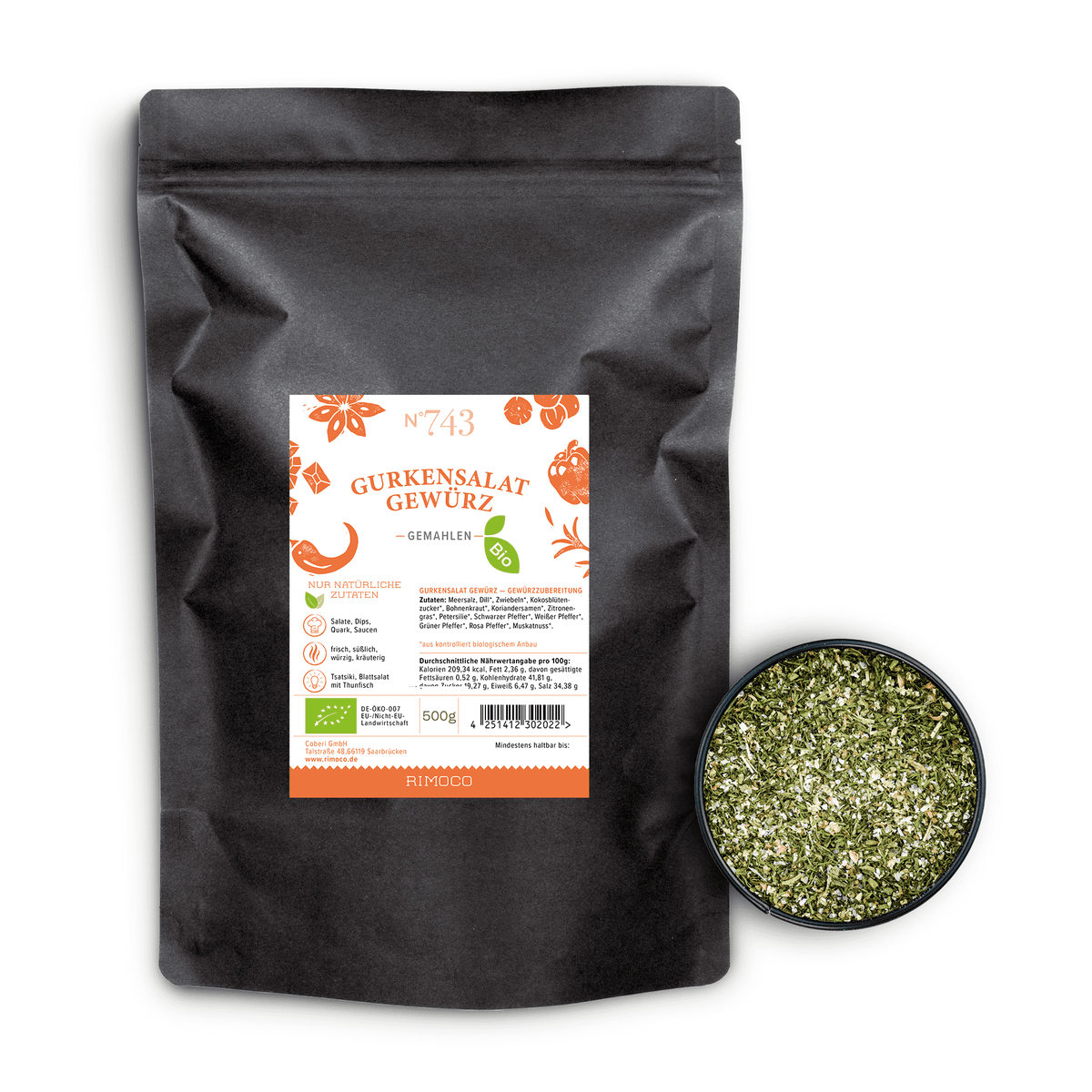 Bio Gurkensalat Gewürz neben einer kleinen Schale mit grober, kräuterhaltiger Gewürzmischung.