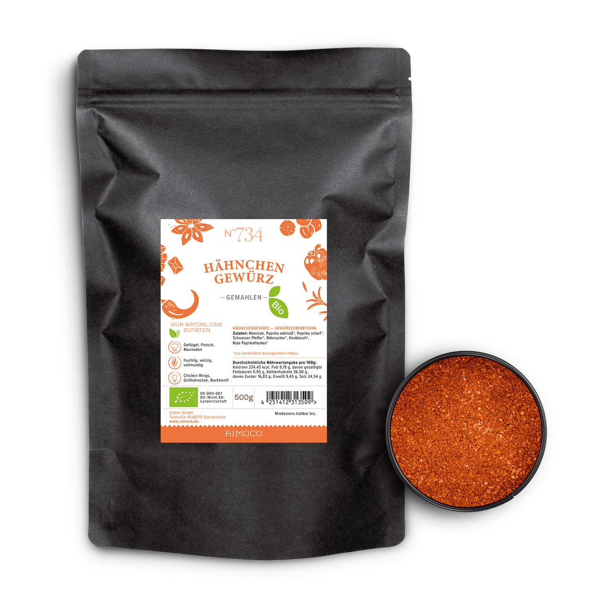 Bio Hähnchengewürz neben offenem Behälter mit orange-roter, fein gemahlener Gewürzmischung.