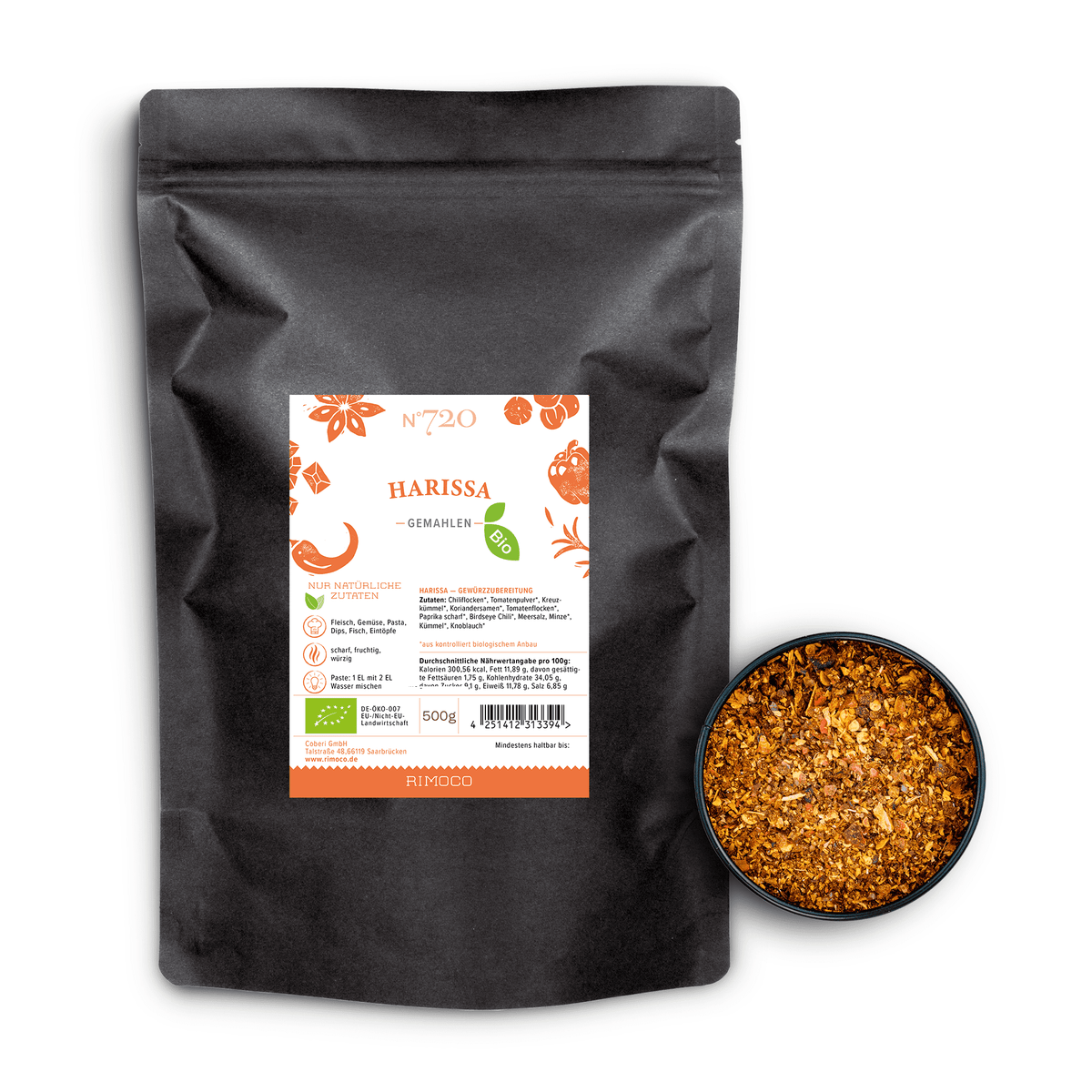 Bio Harissa Gewürz im schwarzen Beutel neben Schale mit marokkanischer, gemahlener Gewürzmischung.