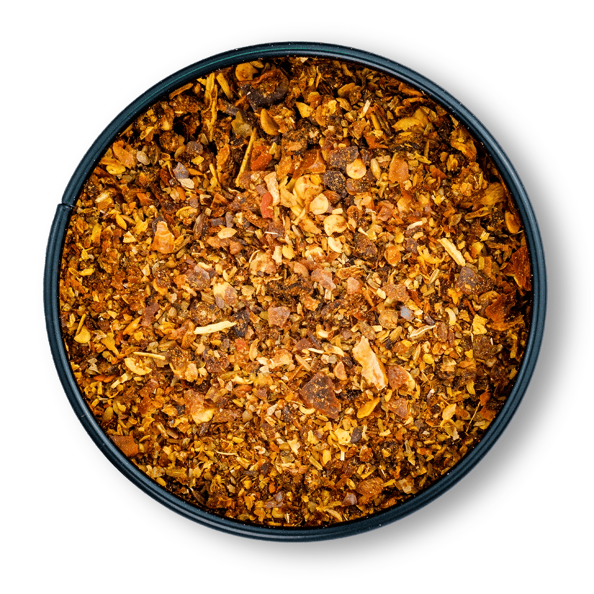 Runde schwarze Dose mit grobem, rotbraunem Bio Harissa Gewürz gefüllt.