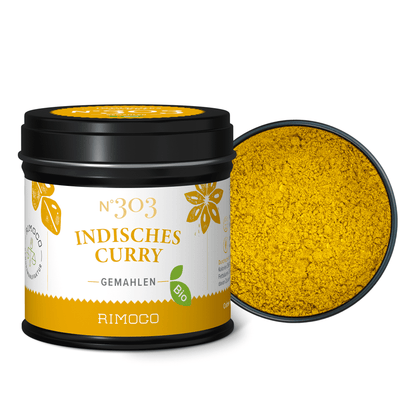 Bio Indisches Curry, schwarze und gelbe Dose mit geöffnetem Deckel, Curry-Pulver sichtbar.