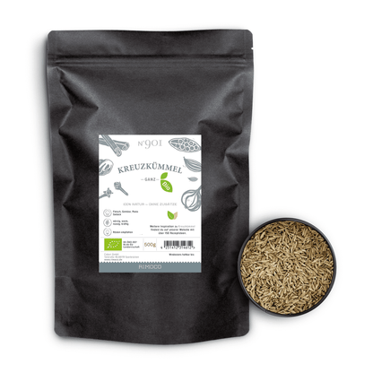 Eine schwarze Packung Bio Kreuzkümmel steht ganz neben einer Schale mit ganzen Kreuzkümmelsamen.