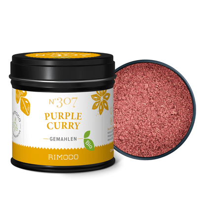 In einer offenen Dose Bio Purple Curry sind feine, orientalische Currypulver zu sehen.