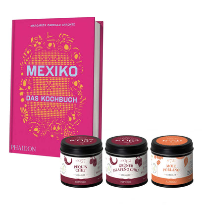 Geschenkset Mexiko mit rosa Kochbuch und drei Gläsern Pequin-Chili- und Mole-Pasten davor.