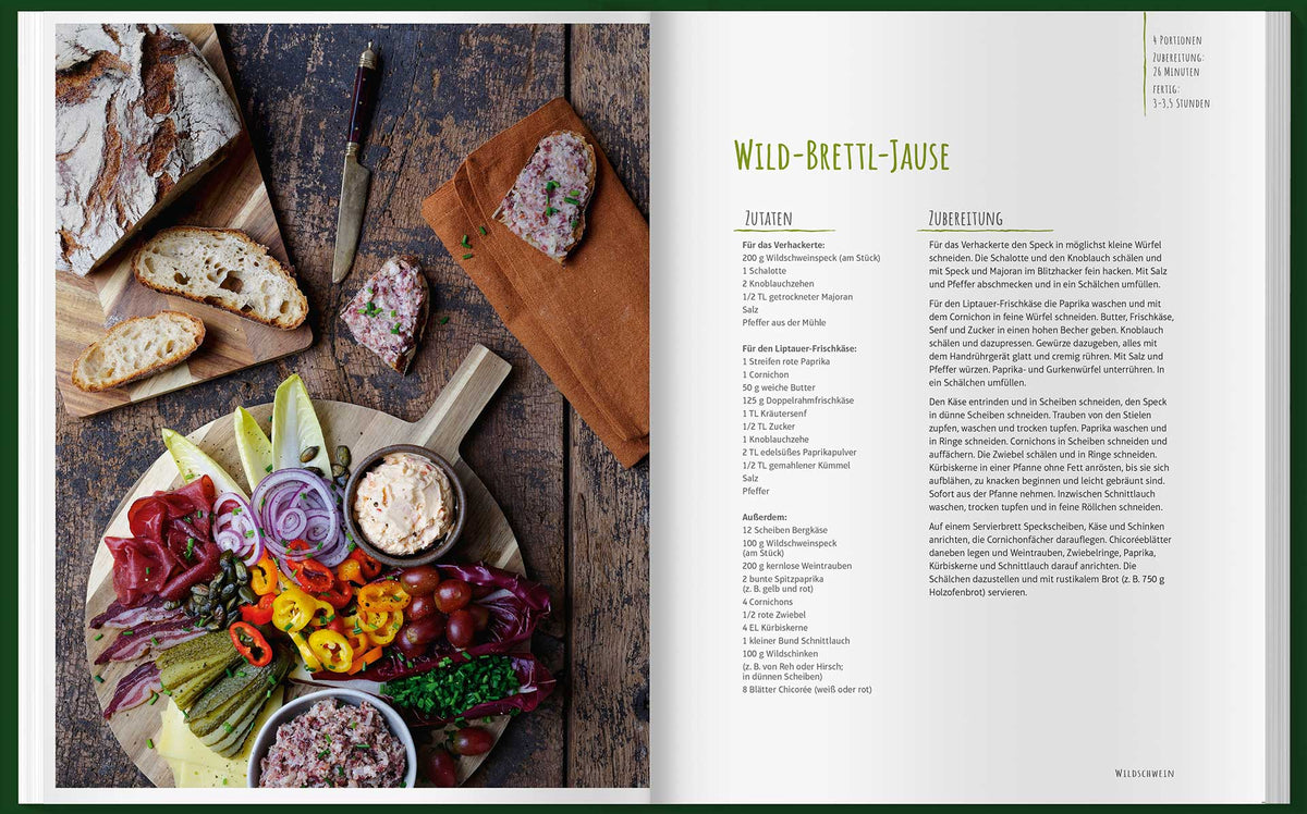 Brot, Pastete, Käse, Gemüse und das Geschenkset Einfach mal Wild auf einem rustikalen Holzbrett.