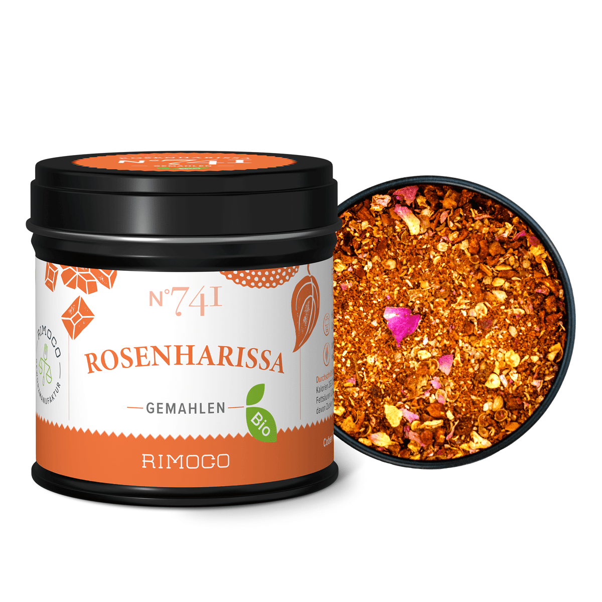 Geöffnete Dose mit Bio Rosenharissa, darin bunter, grober Gewürzmix sichtbar.