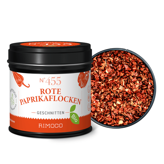 Bio Rote Paprikaflocken, geöffnete Dose mit abgenommenem Deckel, Inhalt sichtbar.