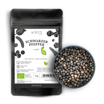 Bio Schwarzer Pfeffer Beutel neben einer Schale mit ganzen schwarzen Pfefferkörnern.