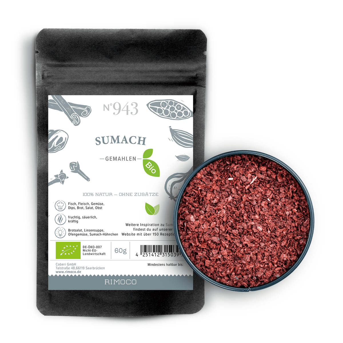 Rundes Schälchen mit rotem gemahlenem Gewürz neben schwarzem Bio Sumach gemahlenem Beutel.