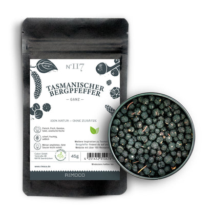 Tasmanischer Bergpfeffer in schwarzer Packung und eine Schale mit Beeren auf weißem Hintergrund.