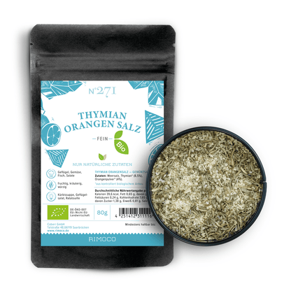 Bio Thymian Orangensalz im Beutel neben einer Schale Bio Meersalz mit mediterranen Kräutern.