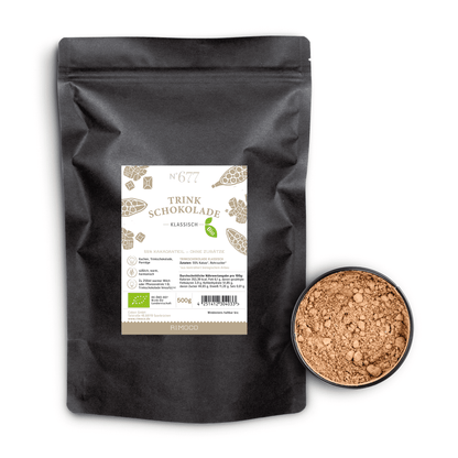 Bio Trinkschokolade klassisch Beutel neben offener Dose mit sichtbarem Kakaopulver.