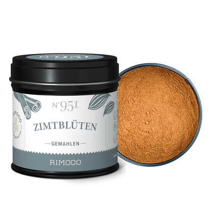 Dose mit Aufschrift Zimtblüten gemahlen, gemahlenes Gewürz sichtbar, Deckel daneben.